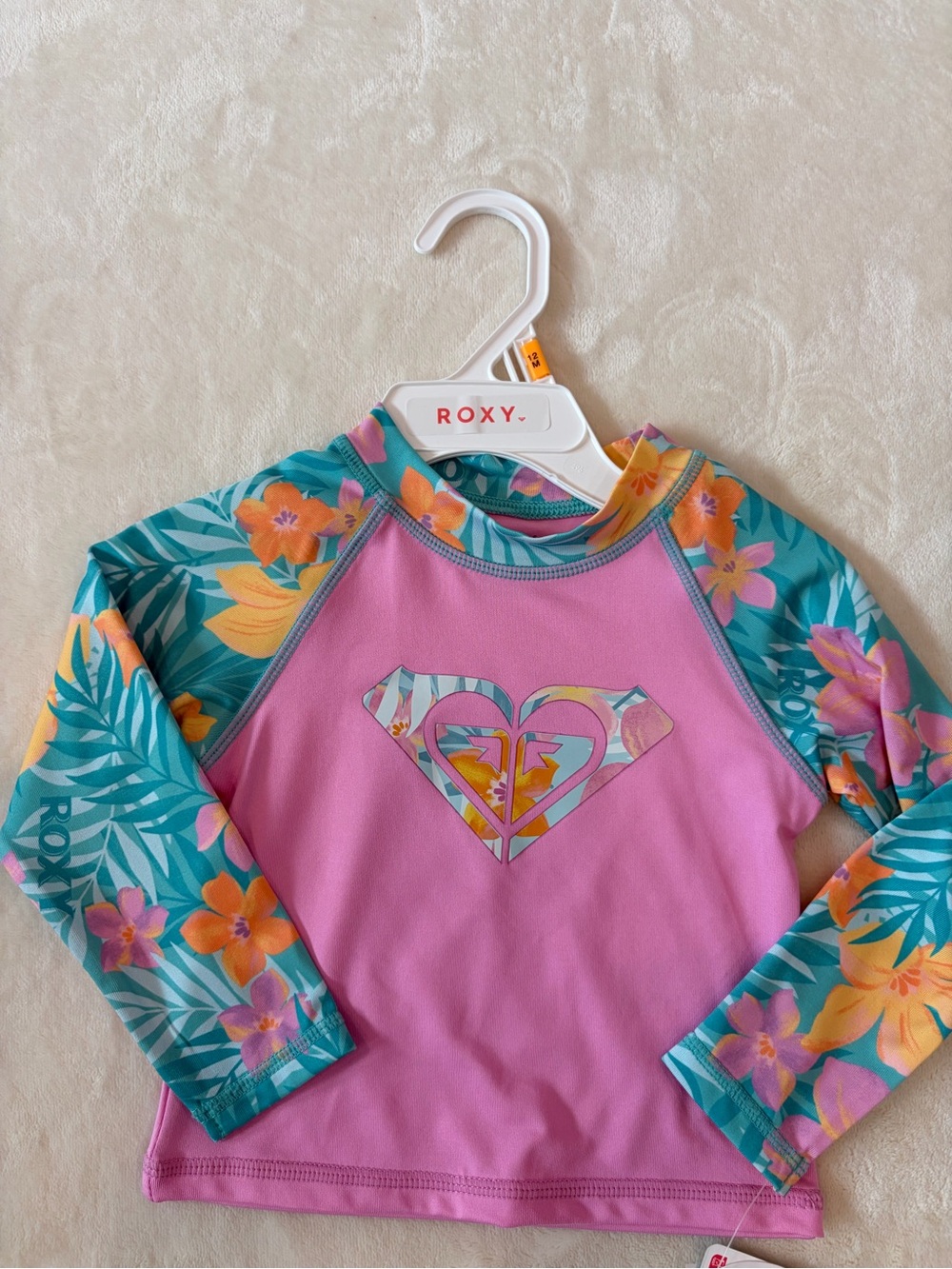 Roxy Pink Front-Logo Rashguard with Teal Floral Sleeves